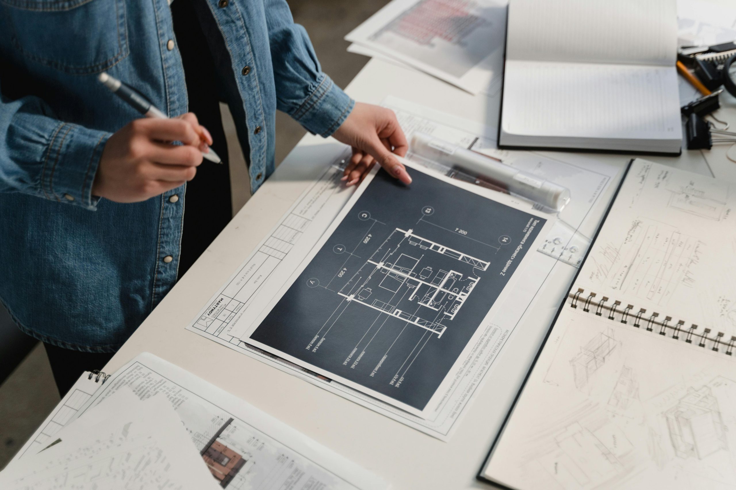 Engineer or architect working on a plan.