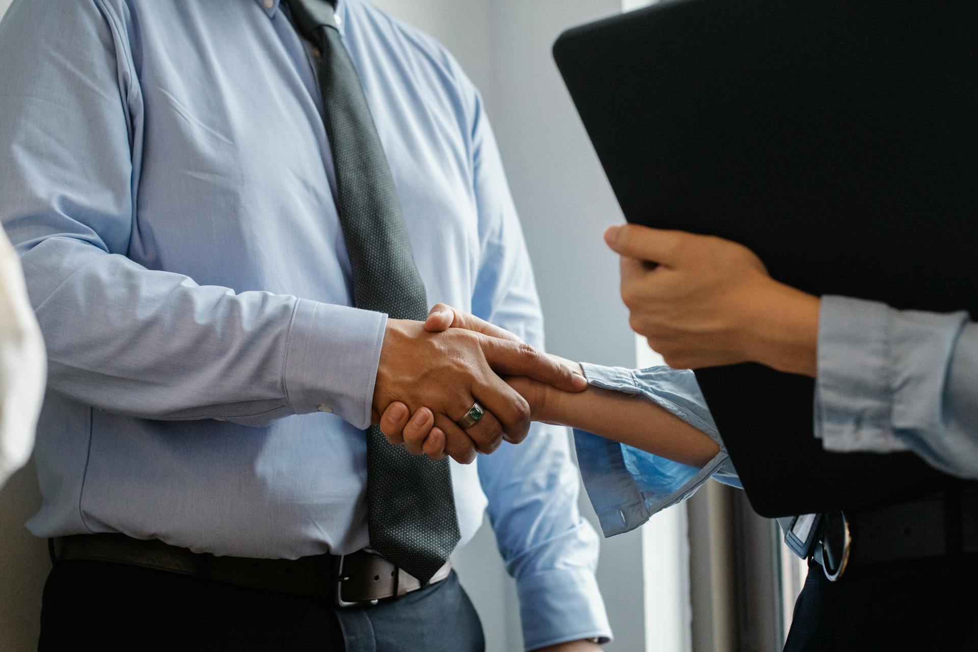 An employee is being praised by their supervisor