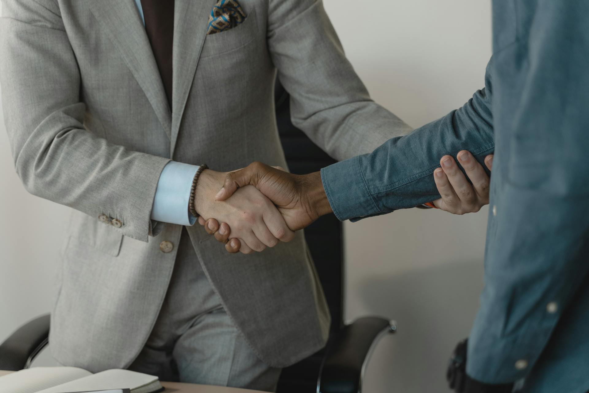 Handshake between two insurance brokers.