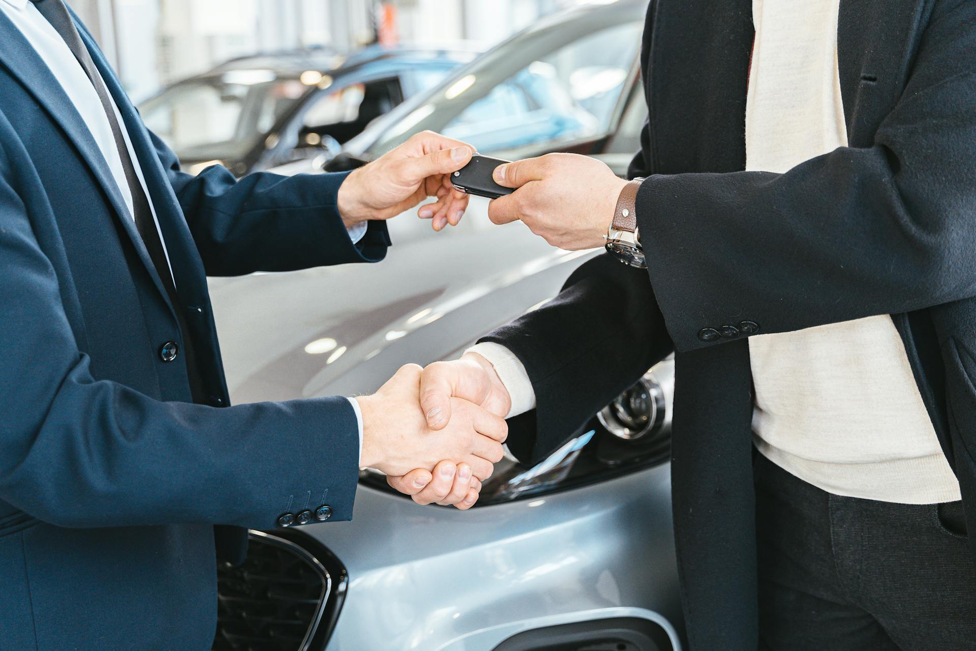 A customer receives a new car.